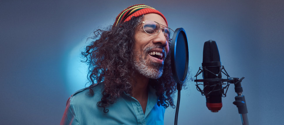 man singing at the studio