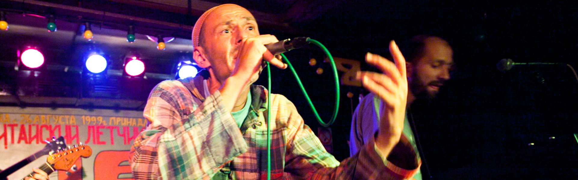 man singing at the stage